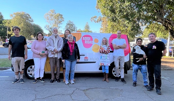 Volunteers with the NSW Government funded electric food delivery van. Volunteers with the NSW Government funded electric food delivery van.