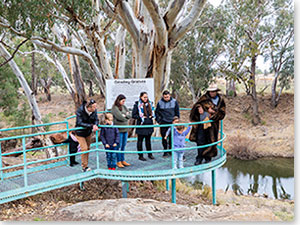 Peter Peckham of First Lesson Cultural Tours, Dubbo sharing his knowledge of aboriginal tools and the Grinding Grooves site. Credit: Destination NSW