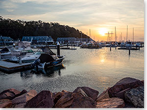 Sun setting over Anchorage Marina, Corlette in the Port Stephens region. Credit: Destination NSW