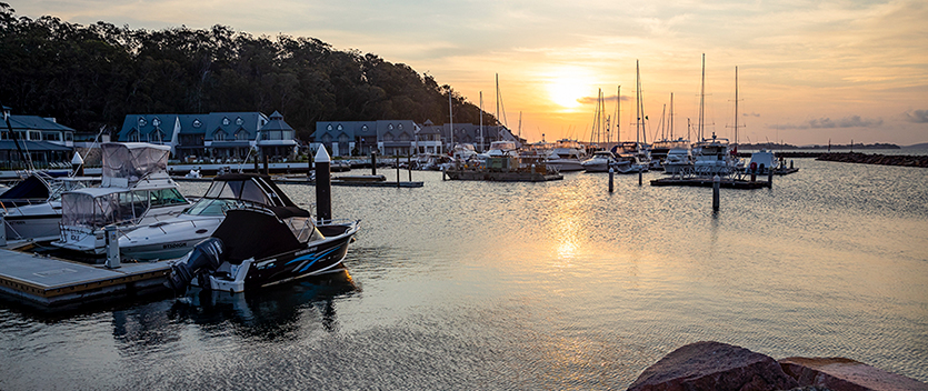 Sun setting over Anchorage Marina, Corlette in Port Stephens region. Credit: NSW Destination