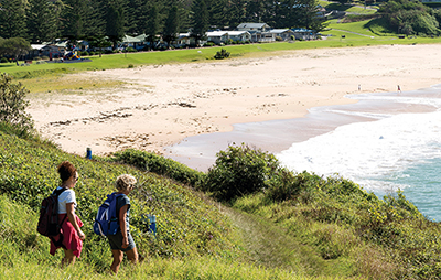 Two women walking along the Kiama coastal walk