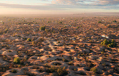 Aerial view of townscape dugout community in outback. Credit: Destination NSW