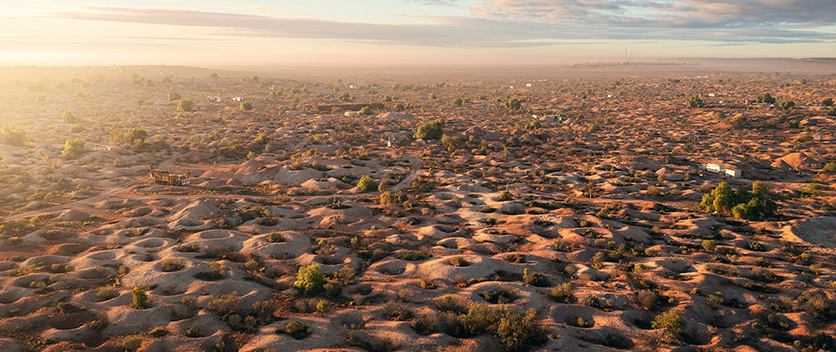 Aerial view of townscape dugout community in outback. Credit: Destination NSW