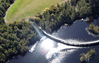 Aerial view of footbridge over wetlands.
