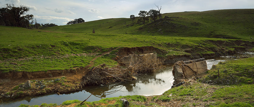 The old bridge at Limestone Creek, Millomolong washed away and the remnants of a house chimney.