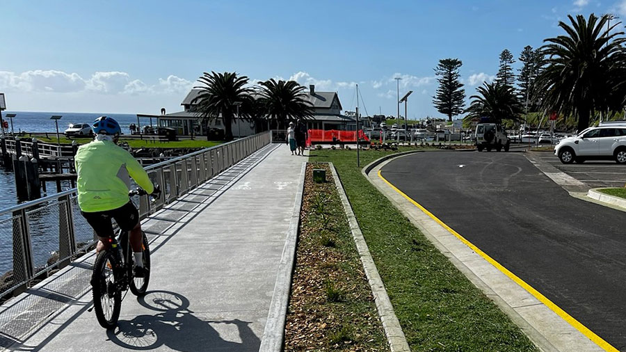 Cyclist next to Kiama's new seawall