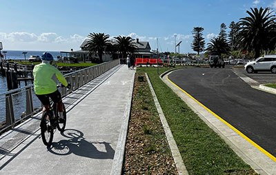 Cyclist next to new Kiama seawall