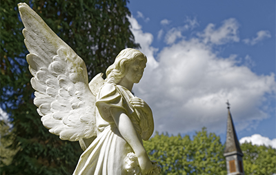Angel statue in cemetery.