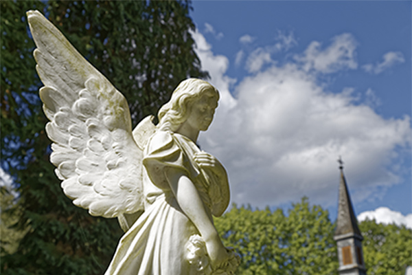Angel statue in cemetery.