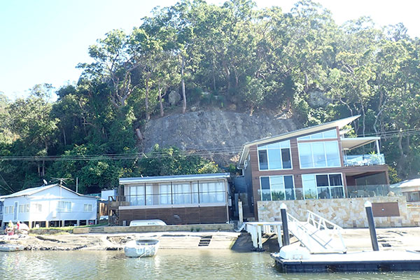 The steep slope behind home sat Patonga