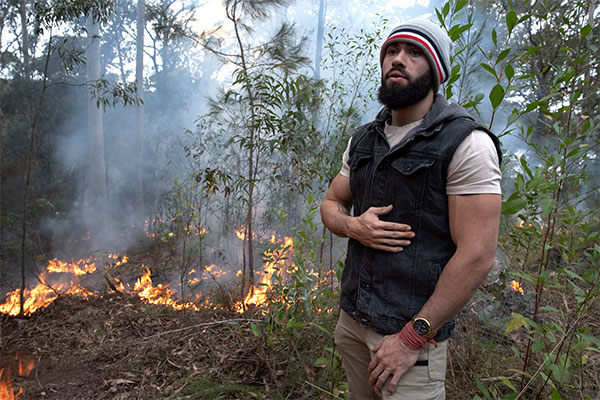 Elder sharing cultural burning knowledge in bush