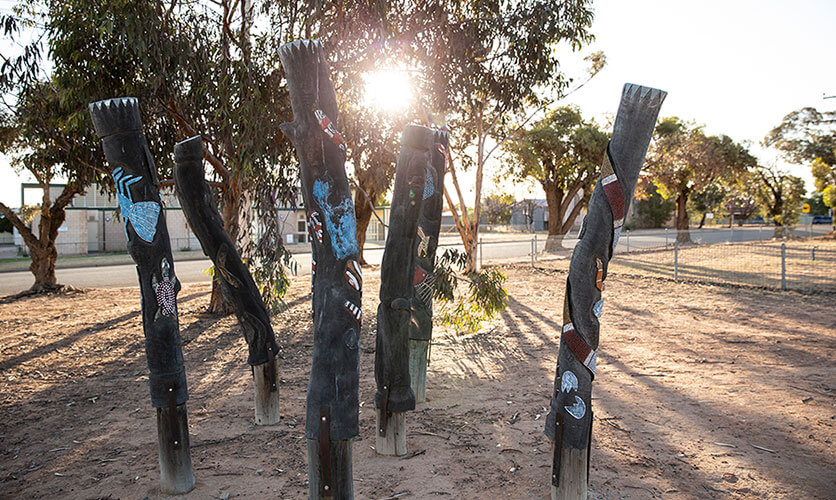 Aboriginal wood carvings near the Menindee Tourist Information Centre. Credit: Destination NSW