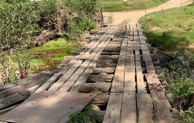 Old wooden bridge over Apple Tree Glen Creek to be replaced with concrete bridge.