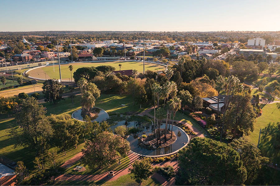 Aerial view over Victoria Park, Dubbo with playing field, lake and bushland. Credit: Destination NSW