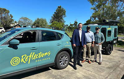 Left-to-right Minister Steve Kamper, Coffs Harbour MP Gurmesh Sing and Reflections CEO Nick Baker at Corindi Beach Reflections Park