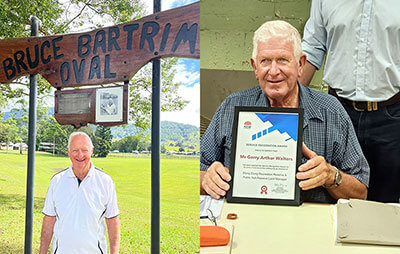 Bruce Bartrim in front of oval sign and Garry Walters with his Award