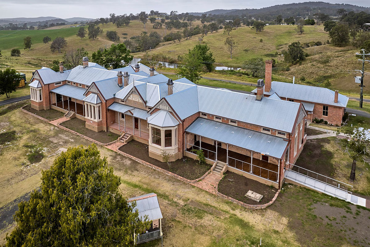 Aerial view of brick building being used as a hospital in rural NSW