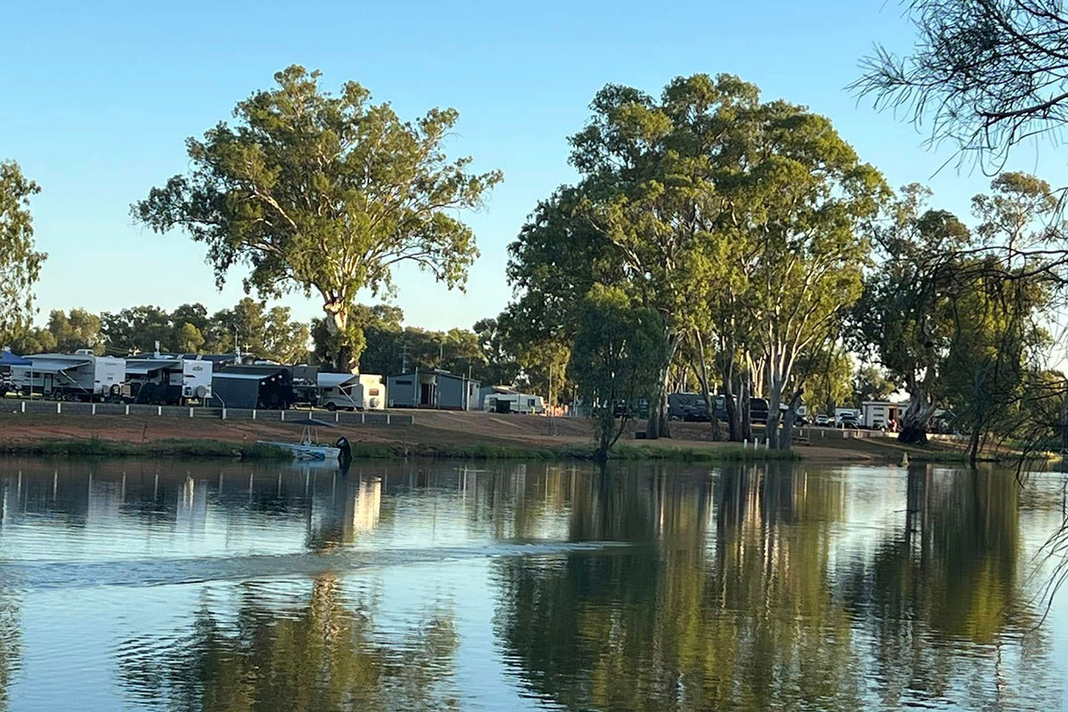 Caravans parked next to river
