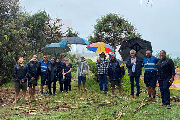 Tweed Byron LALC representatives Des Williams (Chair), Leweena Williams (CEO) and Rangers Tom Phillips, Tom Byrnes, Banahm Slabb and Ernie Williams gathered for the announcement with Fingal Elders Aunty Chris Morgan, Aunty Marcia Browning, Uncle Clarry Williams, Uncle Kevin Slabb, Aunty Dale Williams and Jaydee Rotumah-Weir, and Tweed MP Geoff Provest, Crown Lands Manager Katherine Knight, and Tweed Shire Council’s Jane Lofthouse. Tweed Byron LALC representatives