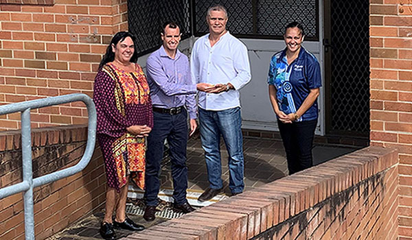 Crown lands staff Juanita McCathy, Matt Terrill hand over the keys Biraban Local Aboriginal Land Council Chairman Edward Smith and CEO Ashley Williams