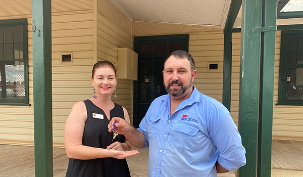 Anthony Azevedo from Crown Lands' Bourke office hands over the keys to Alicia Tiffen from CatholicCare Willcannia-Forbes.