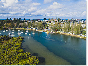 Aerial view overlooking Calypso Holiday Park and the scenic Clarence River. Credit: Destination NSW