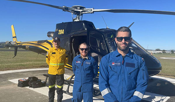 RFS officer Andrew Davis; Crown Lands officers Scott Vale, and mission commander Shaun Flood at Albury Airport