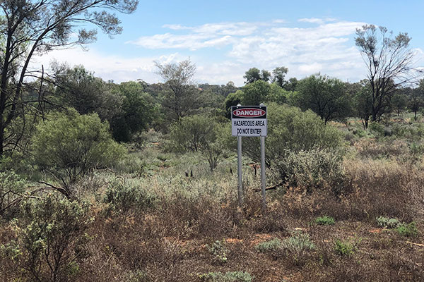 Kaloogleguy Reserve with one of the temporary signs warning people to keep out of the affected area