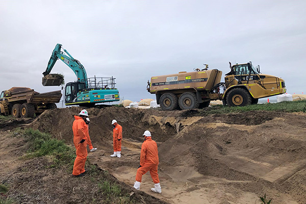Work crews removing buried waste on North Stockton Beach. Work crews removing buried waste on North Stockton Beach.